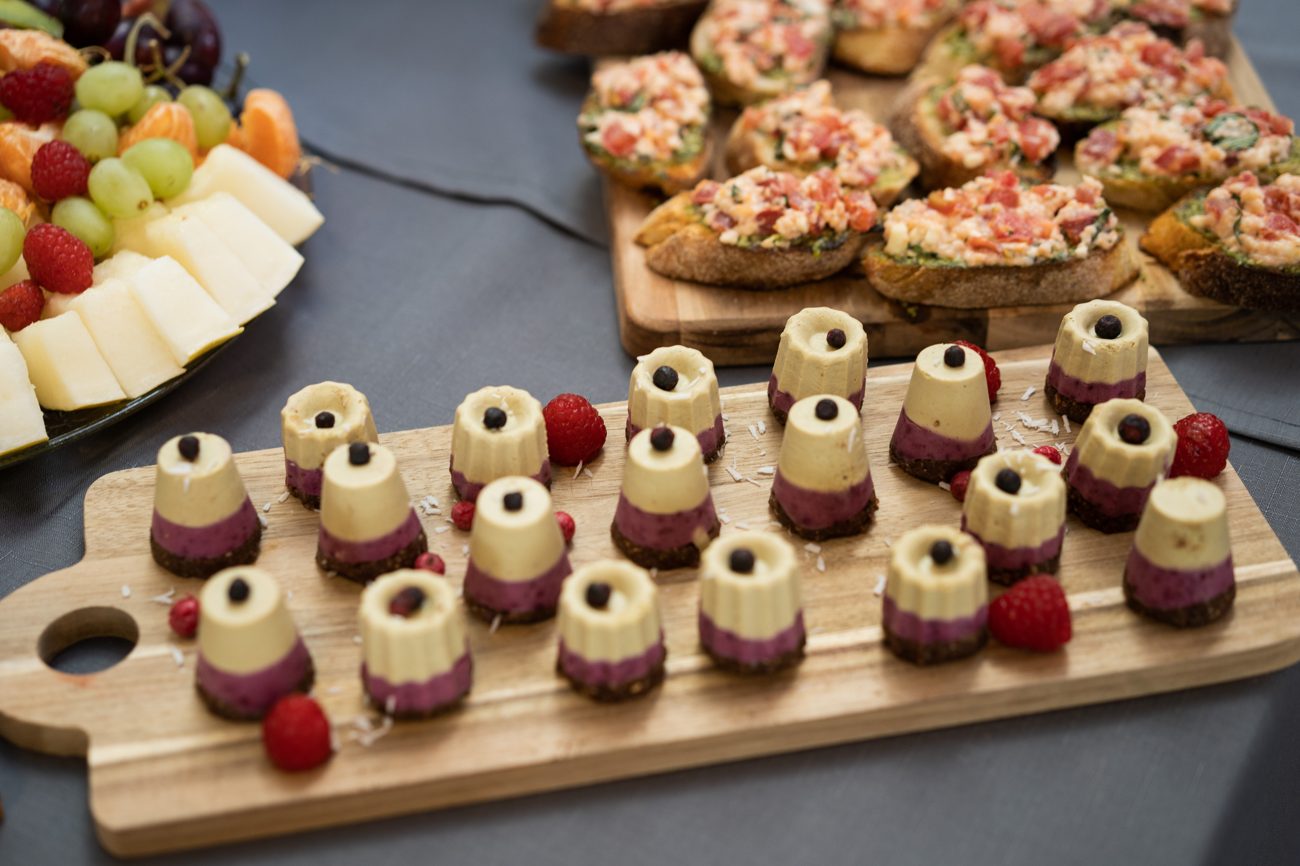 Mini raw cakes on wooden boards for a reception