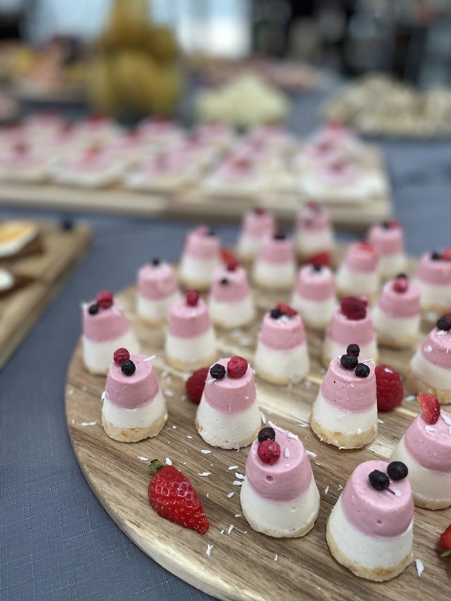 Board of raw mini-cakes with berries